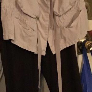 A vest and brown pants.